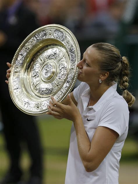 The gentlemen's and ladies singles trophies. 2014 Wimbledon: Women's Singles Championships