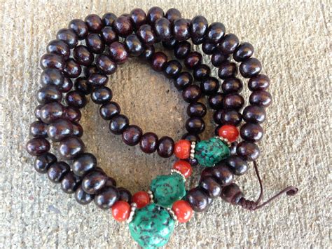peachwood mala with simulated turquoise and coral 8mm serenity tibet singing bowls