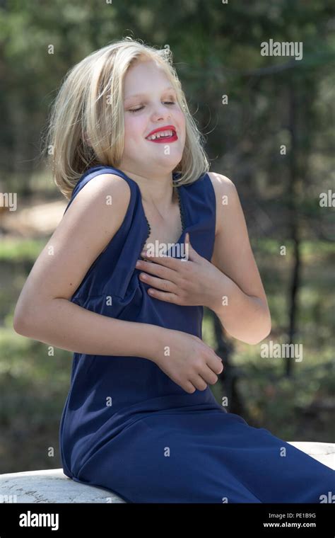 Pretty Young Blonde Preteen Fashion Shoot Sitting On Rock Outside 34 Profile Blue Dress