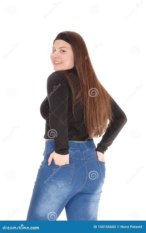 Tiener Die Zich Van De Rug In Jeans Bevinden Stock Foto Image Of