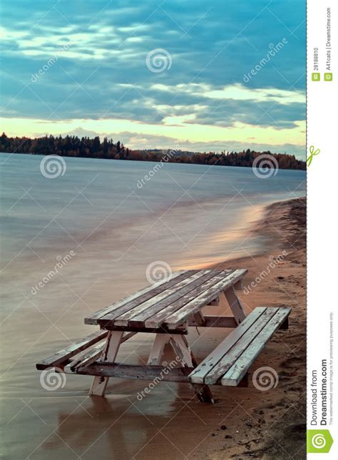 A life of a mother and her two children breaking down quietly without showing any. Bench And Table Sunk Into The Sand Stock Photo - Image of ...