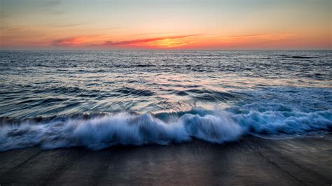 Download Wallpaper 2560x1440 Sea Waves Spray Sunset Widescreen 169