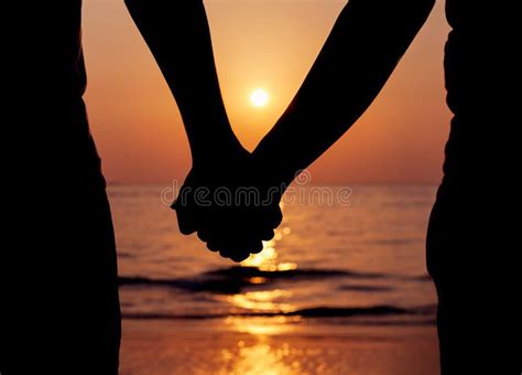Silhouettes Couples Holding Hands Stock Image Image Of Hands Coast