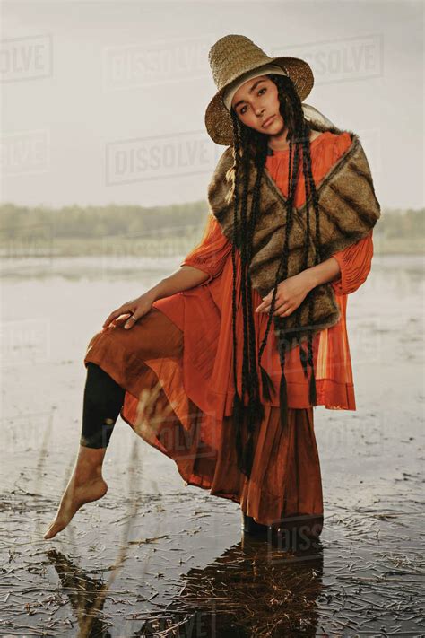 Caucasian Woman Wearing Traditional Clothing Wading In Water Stock