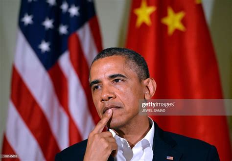 Us President Barack Obama Listens As Chinese President Xi Jinping