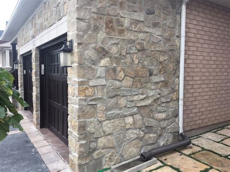 I have an exterior painted wall and am interested in installing a stone veneer. 101 Resources - Stacked Stone Tile House | Stone veneer ...