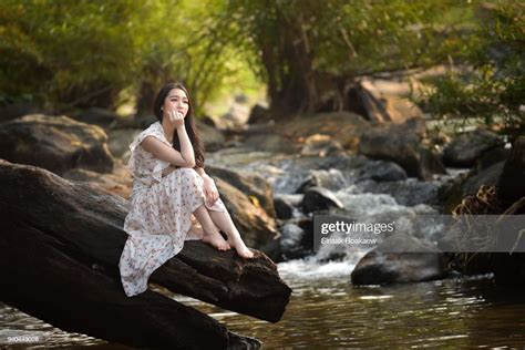 Beautiful Girl Sitting Lonely At The River Photo Getty Images