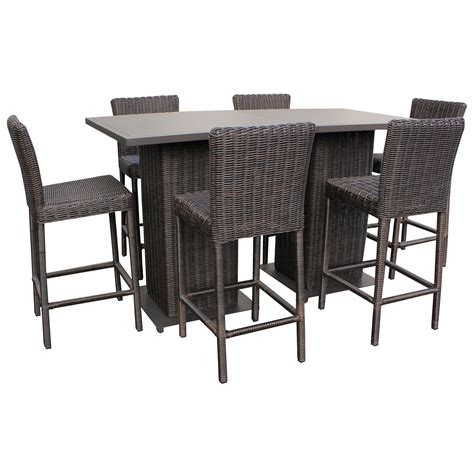 This round outdoor bar table is easily portable and perfect for your backyard patio or deck — a place for people to stand or sit around with their drinks and chat for hours. Outdoor 5 Piece Pub Table Set | Wicker Pub Table and Chairs