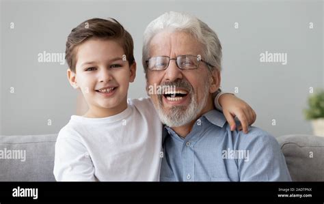 Head Shot Portrait Little Grandson Embraces Grey Haired Elderly