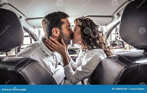 Happy Beautiful Couple In Love Kissing In A New Car Stock Photo Image