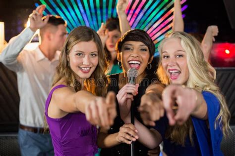 Female Friends Singing Song Together In Bar Stock Image Image Of
