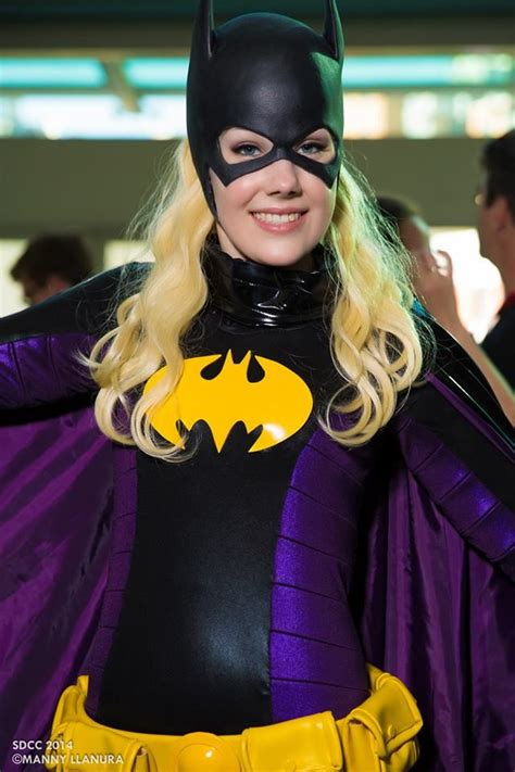A Woman Dressed As Batman Poses For The Camera