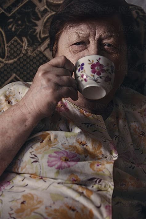 Senior Woman Drinking Tea At Home Del Colaborador De Stocksy Ilya Stocksy