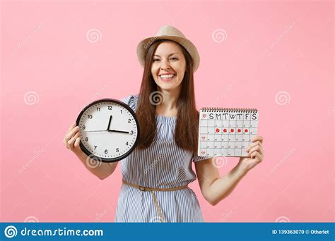 Smiling Pretty Woman In Blue Dress Hat Holding Round Clock Periods