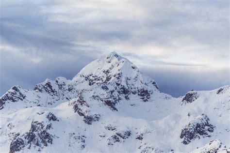 Aerial View Of Snowy Mountain Peak Snow Mountain Cold Pictures