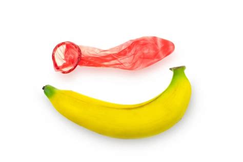 Premium Photo Red Condom Wear A Banana Concept Safe Sex Prevention Of