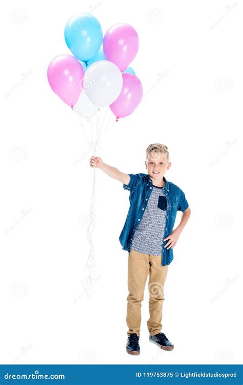 Cute Happy Boy Holding Balloons And Smiling At Camera Stock Image
