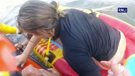 porthcawl rnli launch to two teenage girls swept out to sea on an inflatable dinghy youtube