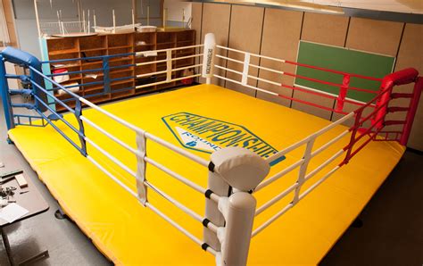 A modern ring consists of a square raised platform with a post at each corner. Elevated Boxing Ring - Abbotsford Misson Boxing Club