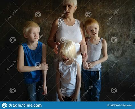 Three Blonde Brothers Pose In Studio Next To Their Mother Boys And A