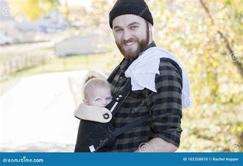 Millenial Dad With Baby In Carrier Outside Walking Stock Photo Image