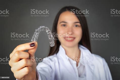 Beautiful Smiling Turkish Girl Keeping Clear Aligner On Her Hand Stock