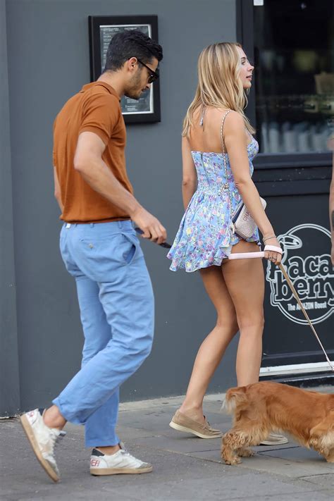 Kimberley Garner Puts On A Leggy Display In A Floral Print Blue Mini Dress While Out With