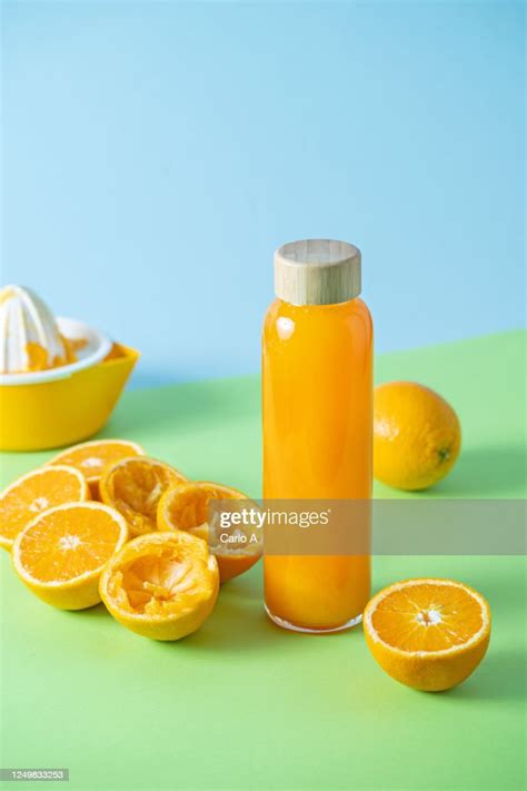 Freshly Squeezed Orange Juice In Glass Bottle High Res Stock Photo