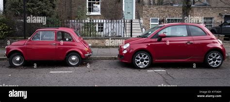 Two Red Fiat Cars Parked On A Residential Street Stock Photo Alamy