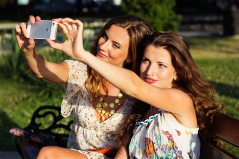 Two Friends Taking Selfie By Smartphone Stock Image Everypixel