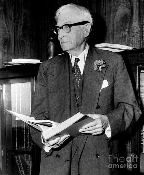 Bernard Baruch Looking Over Book Taken From His Office Library 1959