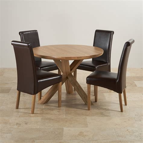 Dining table constructed of solid hardwood black and cottage oak finish round shape wood top seats 4 pedestal base transitional style casual dining ready to assemble specifications: Natural Real Oak Dining Set: Round Table + 4 Brown Leather ...