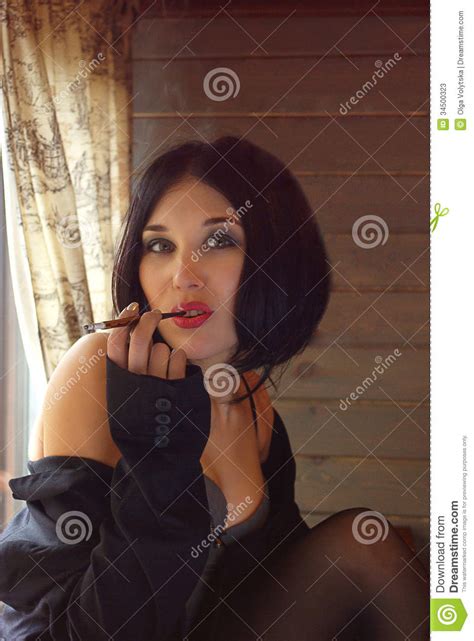 Retro Beautiful Woman With Cigarette Holder Stock Photos