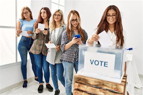 Group Of Young Voter Woman Smiling Happy Putting Vote In Voting Box At
