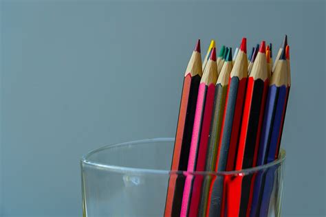 Color Pencils In Clear Drinking Glass Photo Free Pencil Image On Unsplash