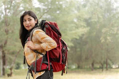 Asian Beautiful Female Backpacker Tourists In The Forest Looking
