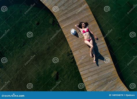 Aerial Drone View Woman In Swimsuit Sunbathing On The Pier Hot Sex Picture