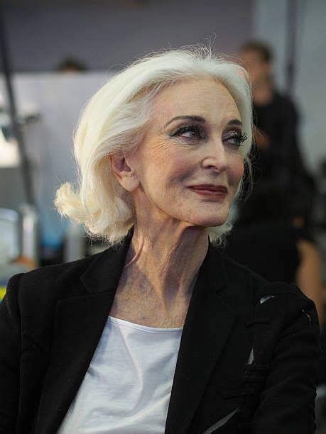 legendary model carmen dell orefice awaits her turn at the makeup table backstage at the