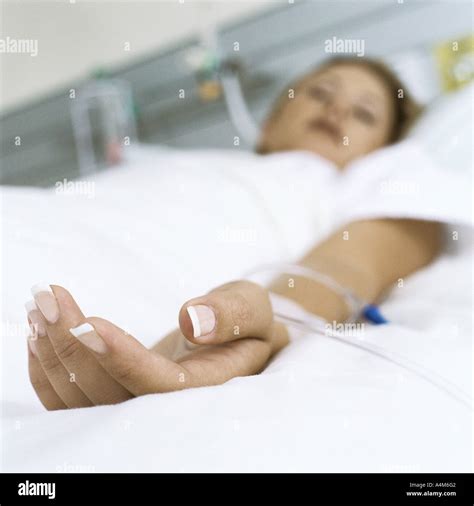 Female Patient Lying In Hospital Bed Stock Photo Alamy