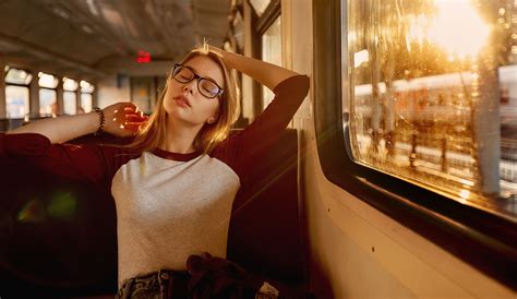 Women With Glasses Closed Eyes Sitting In Train Wallpaper Hd Girls