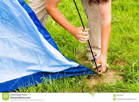 This way you get familiar with all the components, how they go together and, most importantly, the correct sequence for putting them together. Putting Up Tent In A Camping Royalty Free Stock Image ...