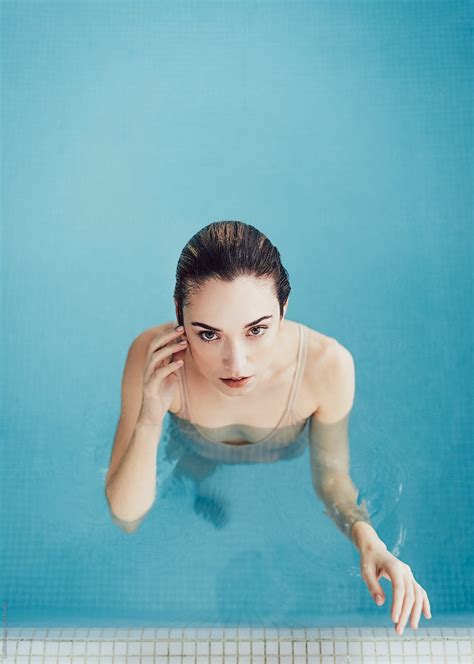 Portrait Of Beautiful Woman In Swimming Pool By Stocksy Contributor