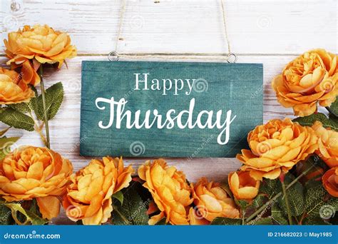 Happy Thursday Text With Flower Decoration On Wooden Background Stock