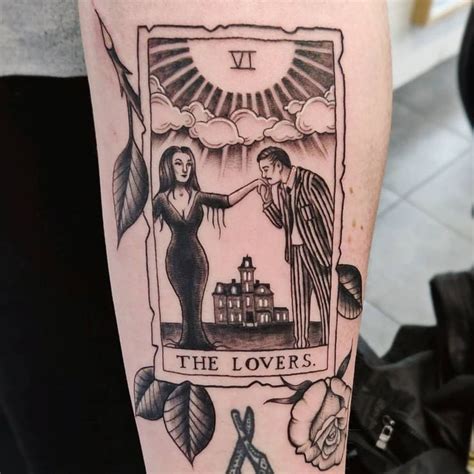 A Tattoo With An Image Of Two People Holding Hands And The Words The