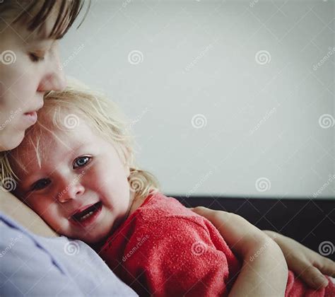 Mother Comforting Crying Little Baby Care And Support Stock Image