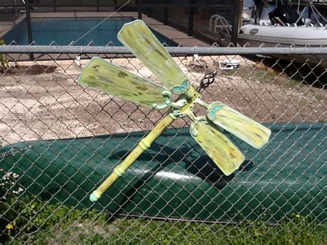 Made A Dragonfly For The Fence Out Of Ceiling Fan Blades And Table Legs