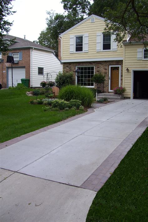 Gray Brushed Concrete Driveway With Decorative Borders With Holland