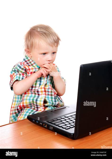Confused Baby Boy With Laptop Isolated On The White Background Stock