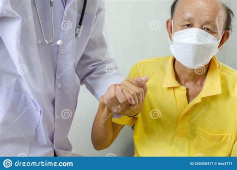 doctor is holding an elderly man`s hand to cheer him up stock image image of closeup