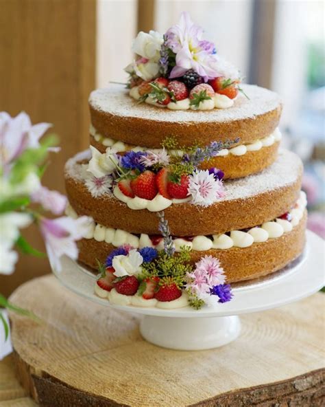 Victoria Sponge Tower With Fresh Cream And Strawberries Decorated With Natural Grown Cornis